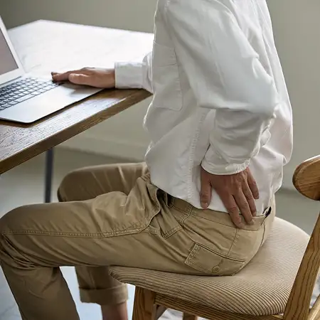 Pain that worsens when sitting