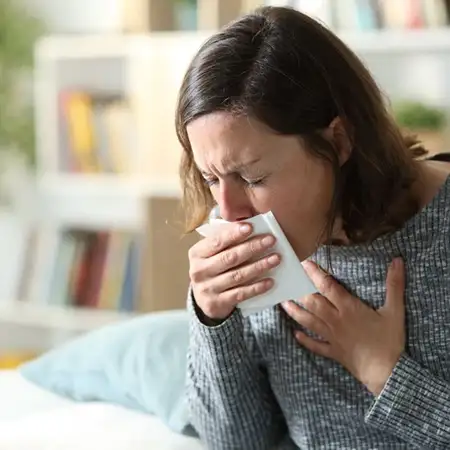 Pain that worsens with coughing or sneezing